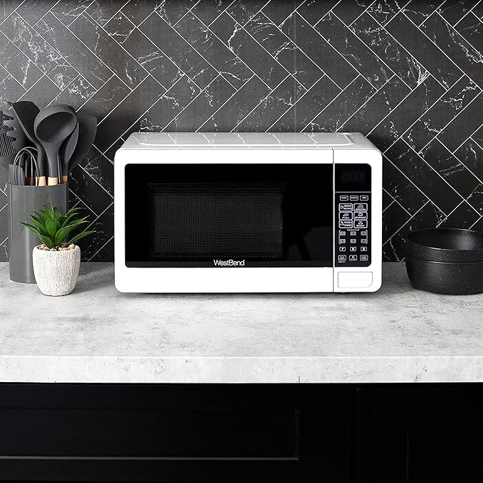 West Bend 0.7 Cu. Ft. Countertop Microwave Oven, 700W with 6 Pre-Programmed Cooking Settings, Speed Defrost, Electronic Control Panel, Rotating Glass Turntable, Add 30 Seconds Button, White